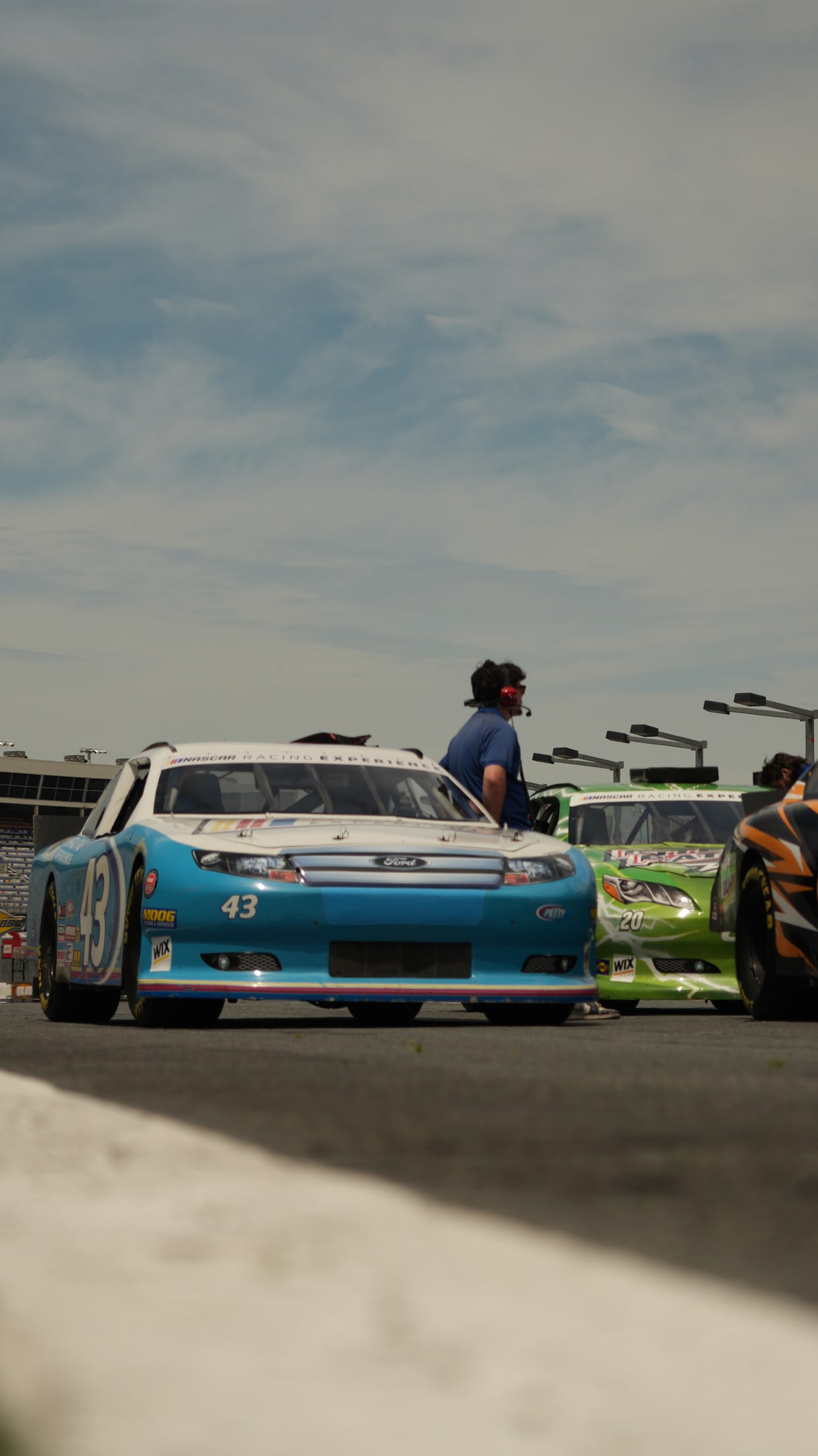 NASCAR Racing Experience cars lined up on pit road
